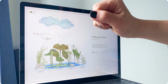 A hand drawing above a laptop showing Watered Lotus